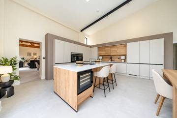 Kitchen with island seating and wine fridge