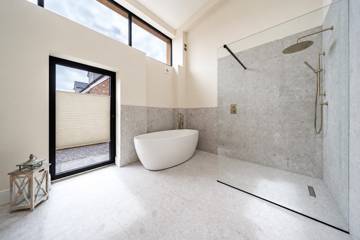 Bathroom with bath and walk-in shower