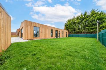 Timber-clad barn and garden