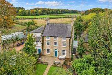 The house and surrounding countryside